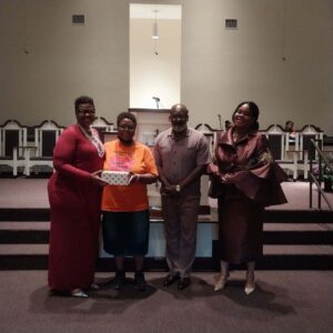 Pastor poses with H&H hosts along with Diane Robinson